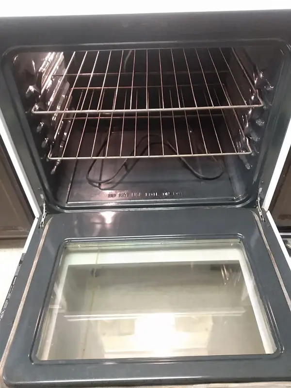 The same oven with clear glass and a wiped-down door and interior